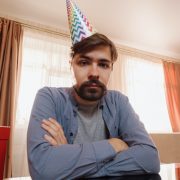 Sad man with party hat